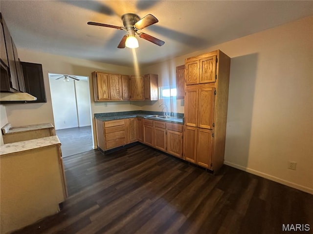 2008 Grace St, Hannibal, MO 63401 - kitchen featuring a ceiling fan, dark wood-style flooring, and brown cabinetry