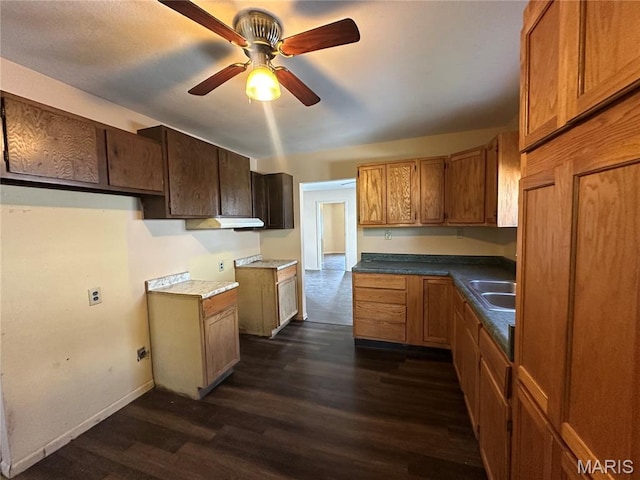 2008 Grace St, Hannibal, MO 63401 - kitchen with dark wood finished floors, ceiling fan, and brown cabinets