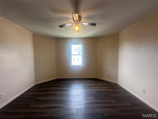 2008 Grace St, Hannibal, MO 63401 - unfurnished room with ceiling fan, dark wood finished floors, and a textured ceiling