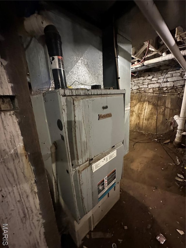 2008 Grace St, Hannibal, MO 63401 - utility room featuring heating unit