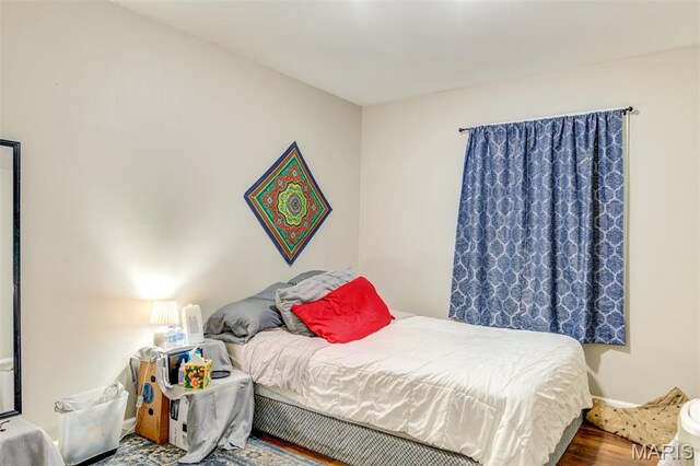 1755 Atmore Dr, Saint Louis, MO 63136 - bedroom featuring wood finished floors and baseboards