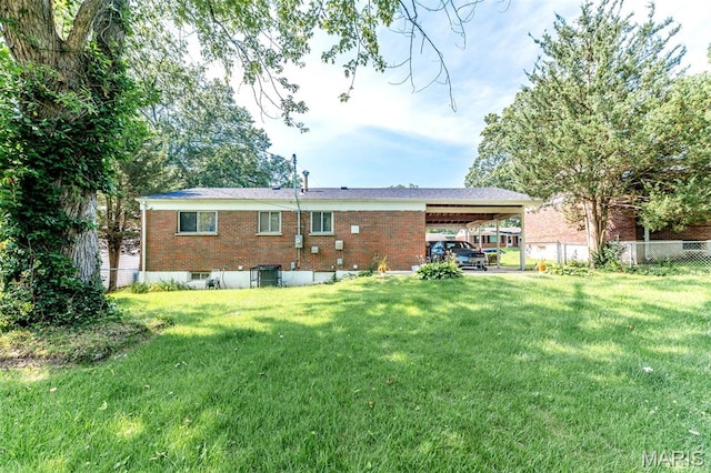 1755 Atmore Dr, Saint Louis, MO 63136 - rear view of property with brick siding and an attached carport