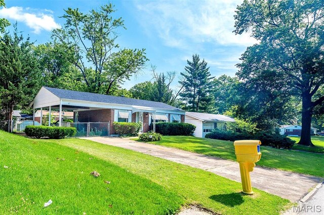 1755 Atmore Dr, Saint Louis, MO 63136 - ranch-style house with brick siding and a carport