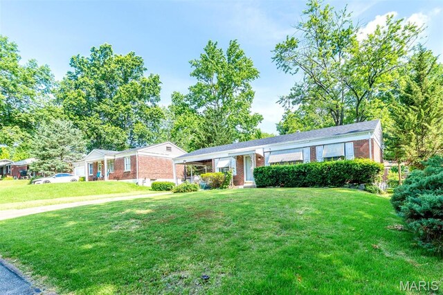 1755 Atmore Dr, Saint Louis, MO 63136 - ranch-style home featuring a front lawn and brick siding
