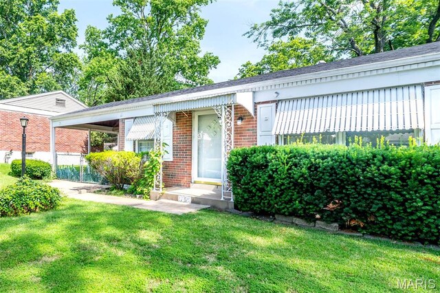 1755 Atmore Dr, Saint Louis, MO 63136 - view of front of property featuring brick siding and a front yard