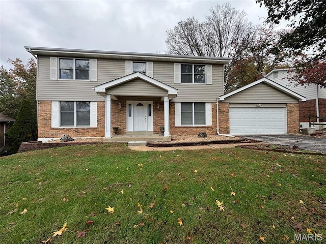 12383 Woodline Dr, Saint Louis, MO 63141 - view of front of house featuring brick siding, a garage, driveway, and a front lawn