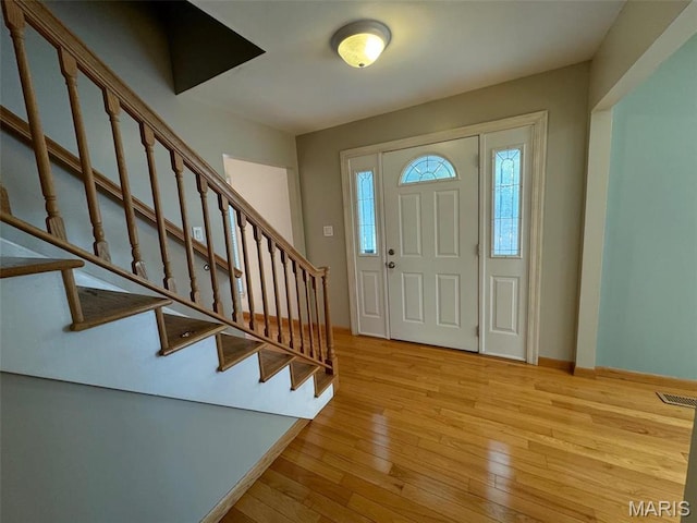 12383 Woodline Dr, Saint Louis, MO 63141 - foyer entrance featuring hardwood / wood-style floors and stairway