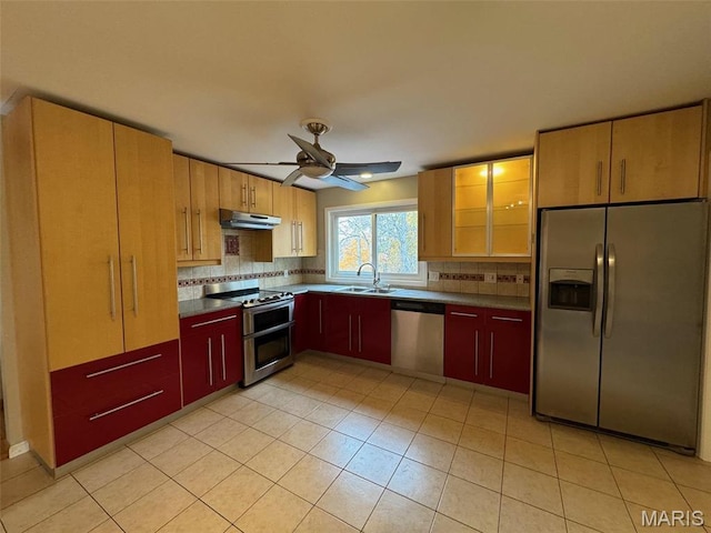12383 Woodline Dr, Saint Louis, MO 63141 - kitchen with stainless steel appliances, under cabinet range hood, backsplash, dark countertops, and ceiling fan