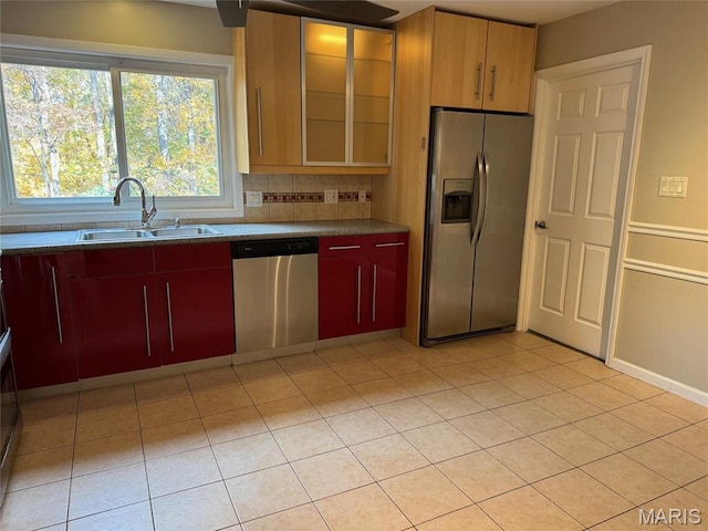 12383 Woodline Dr, Saint Louis, MO 63141 - kitchen with stainless steel appliances, backsplash, light tile patterned floors, dark countertops, and glass insert cabinets
