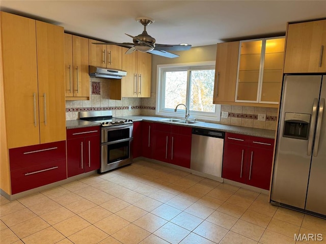 12383 Woodline Dr, Saint Louis, MO 63141 - kitchen featuring appliances with stainless steel finishes, under cabinet range hood, a ceiling fan, dark countertops, and tasteful backsplash