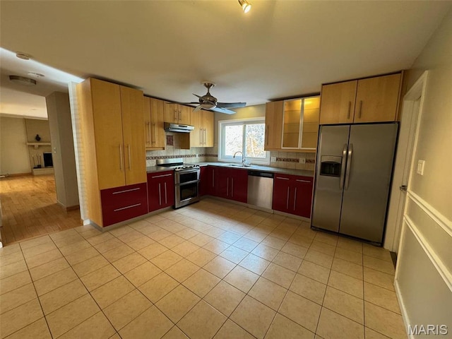 12383 Woodline Dr, Saint Louis, MO 63141 - kitchen featuring appliances with stainless steel finishes, under cabinet range hood, tasteful backsplash, light tile patterned floors, and ceiling fan