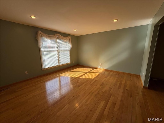 12383 Woodline Dr, Saint Louis, MO 63141 - empty room with wood finished floors and recessed lighting