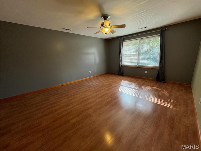 12383 Woodline Dr, Saint Louis, MO 63141 - empty room featuring ceiling fan and wood finished floors