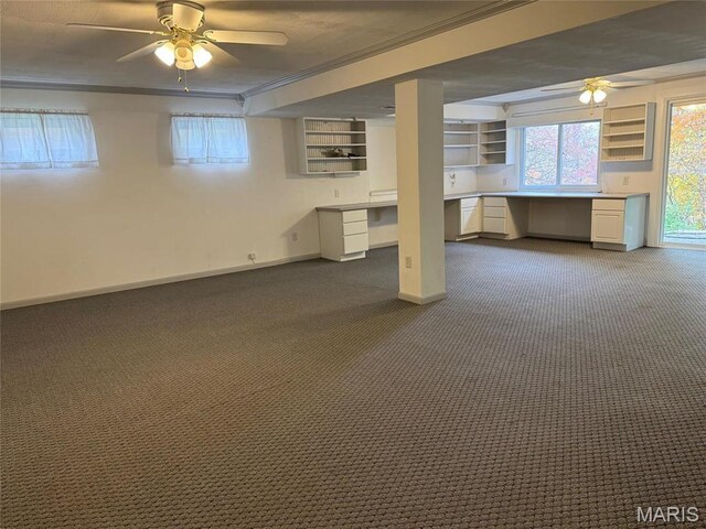 12383 Woodline Dr, Saint Louis, MO 63141 - basement with ceiling fan, built in desk, ornamental molding, and dark carpet