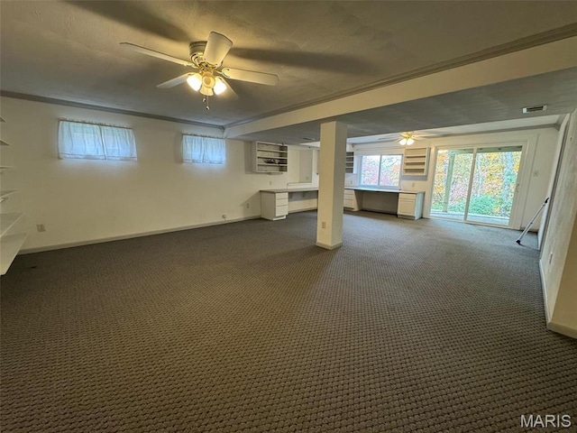 12383 Woodline Dr, Saint Louis, MO 63141 - basement featuring a ceiling fan, dark carpet, and crown molding