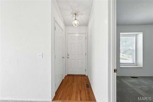 1516 Lienemann Dr Unit 26, Saint Charles, MO 63303 - hallway featuring baseboards and wood finished floors