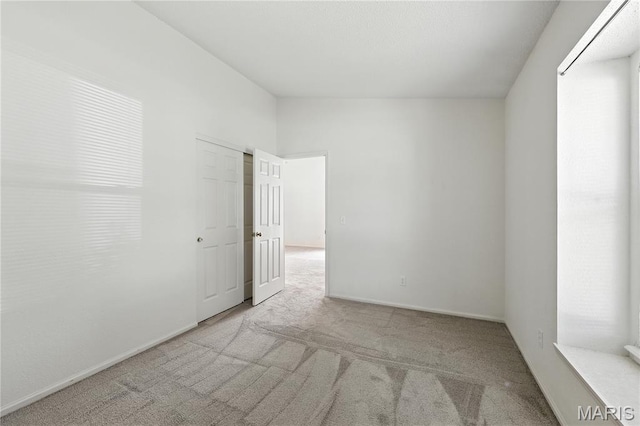 1516 Lienemann Dr Unit 26, Saint Charles, MO 63303 - carpeted empty room with baseboards