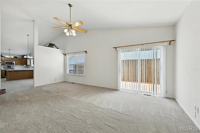 1516 Lienemann Dr Unit 26, Saint Charles, MO 63303 - unfurnished living room featuring ceiling fan, light colored carpet, and high vaulted ceiling
