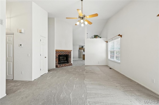 1516 Lienemann Dr Unit 26, Saint Charles, MO 63303 - unfurnished living room with carpet, high vaulted ceiling, a ceiling fan, and a brick fireplace