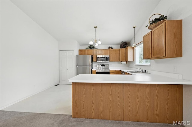 1516 Lienemann Dr Unit 26, Saint Charles, MO 63303 - kitchen with stainless steel appliances, a chandelier, a peninsula, light colored carpet, and brown cabinetry