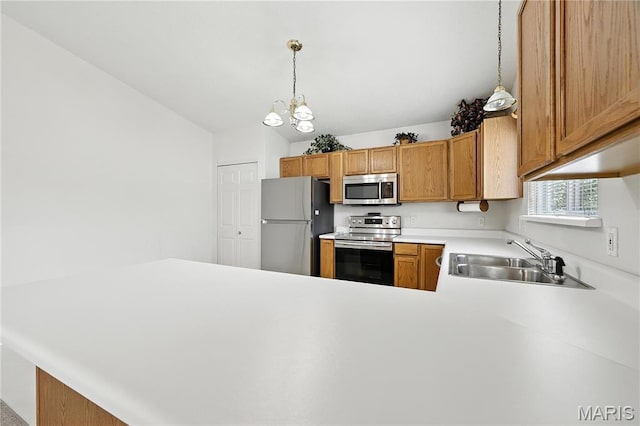 1516 Lienemann Dr Unit 26, Saint Charles, MO 63303 - kitchen with stainless steel appliances, light countertops, a peninsula, pendant lighting, and a chandelier
