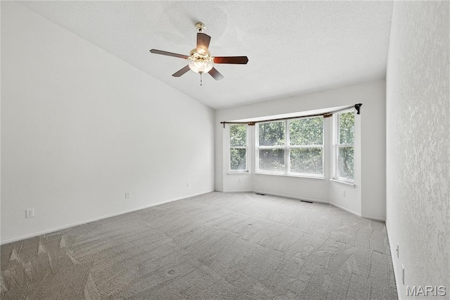 1516 Lienemann Dr Unit 26, Saint Charles, MO 63303 - carpeted empty room featuring ceiling fan, a textured ceiling, and lofted ceiling