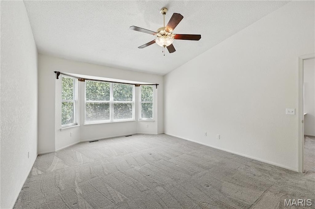 1516 Lienemann Dr Unit 26, Saint Charles, MO 63303 - carpeted spare room with lofted ceiling, a ceiling fan, and a textured ceiling