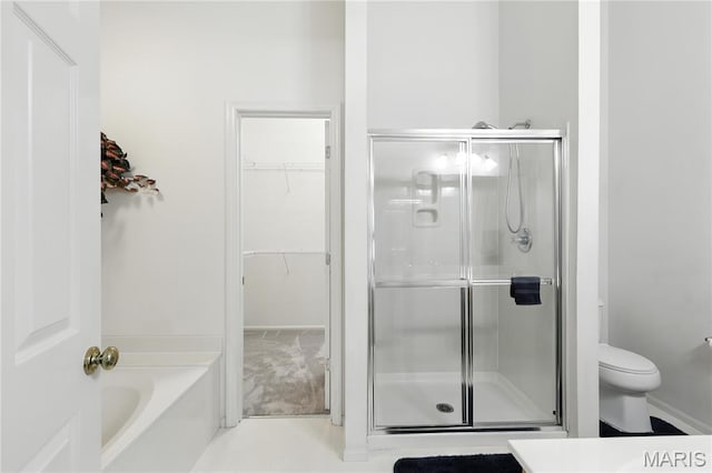 1516 Lienemann Dr Unit 26, Saint Charles, MO 63303 - bathroom featuring a shower stall, a bath, and a spacious closet