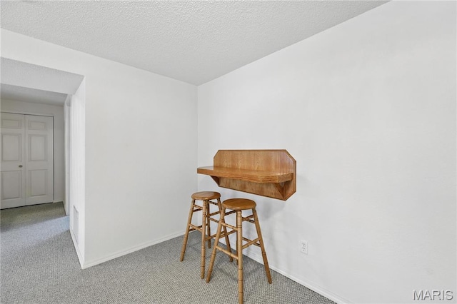 1516 Lienemann Dr Unit 26, Saint Charles, MO 63303 - dining room featuring carpet and baseboards