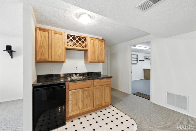 1516 Lienemann Dr Unit 26, Saint Charles, MO 63303 - kitchen with dishwasher, dark countertops, light carpet, and a textured ceiling