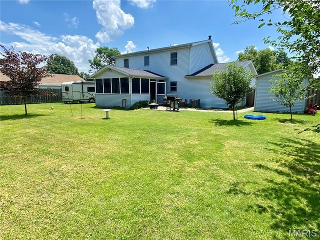 840 Delta Pine Ln, Sikeston, MO 63801 - rear view of property with a sunroom and an outdoor structure