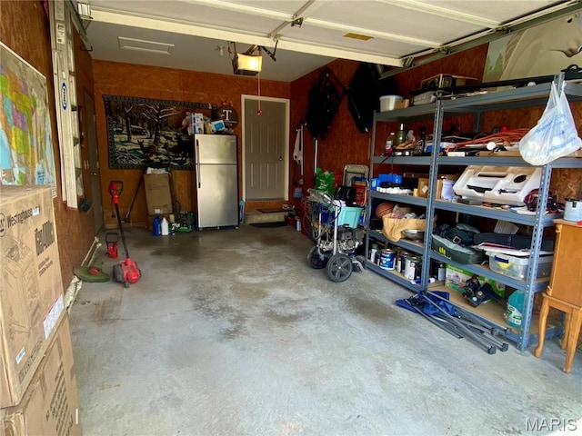 840 Delta Pine Ln, Sikeston, MO 63801 - garage with a garage door opener and freestanding refrigerator