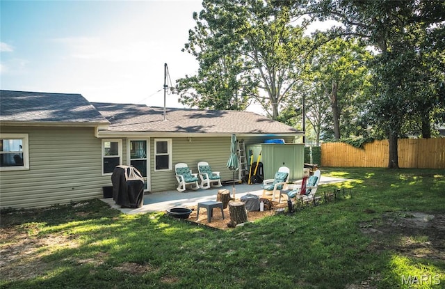 77 Indian Hills Dr, Cuba, MO 65453 - back of property with a patio and a shingled roof