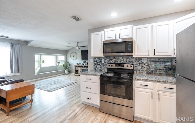 77 Indian Hills Dr, Cuba, MO 65453 - kitchen with stainless steel appliances, backsplash, open floor plan, light wood finished floors, and a ceiling fan