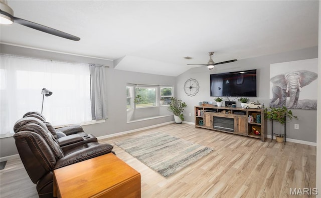 77 Indian Hills Dr, Cuba, MO 65453 - living area with ceiling fan, wood finished floors, and vaulted ceiling