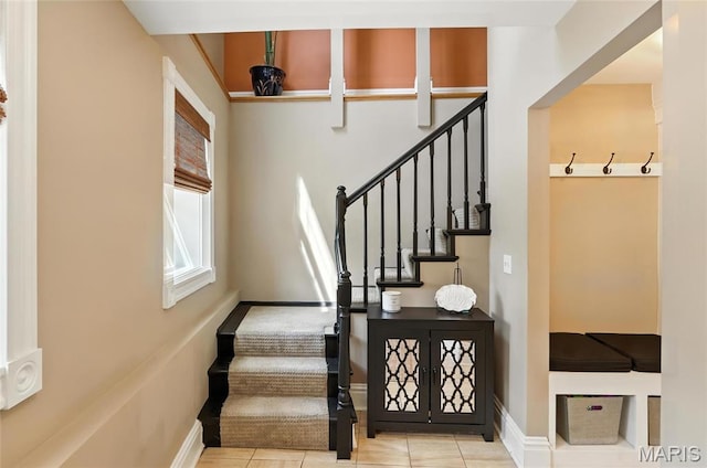 2812 Indiana Ave, Saint Louis, MO 63118 - staircase with baseboards and tile patterned flooring