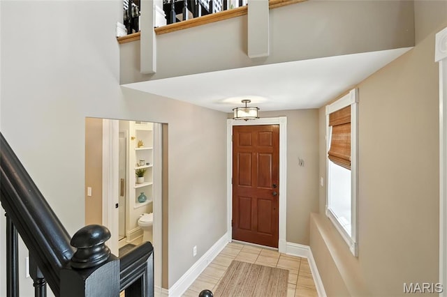 2812 Indiana Ave, Saint Louis, MO 63118 - entrance foyer with light tile patterned floors and stairway