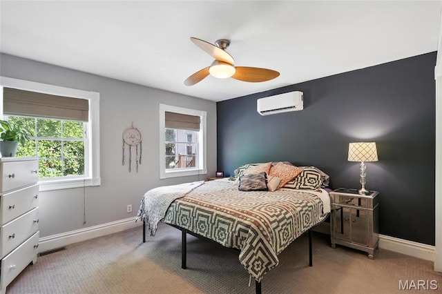 2812 Indiana Ave, Saint Louis, MO 63118 - carpeted bedroom featuring a wall mounted AC and a ceiling fan