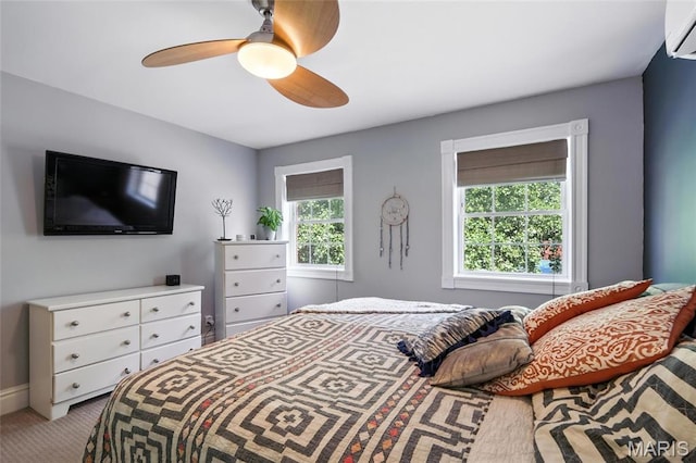 2812 Indiana Ave, Saint Louis, MO 63118 - bedroom featuring carpet, ceiling fan, and a wall unit AC