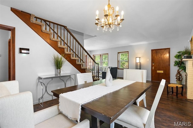 512 N Hills Dr, Saint Louis, MO 63121 - dining area with stairs, wood finished floors, and a chandelier