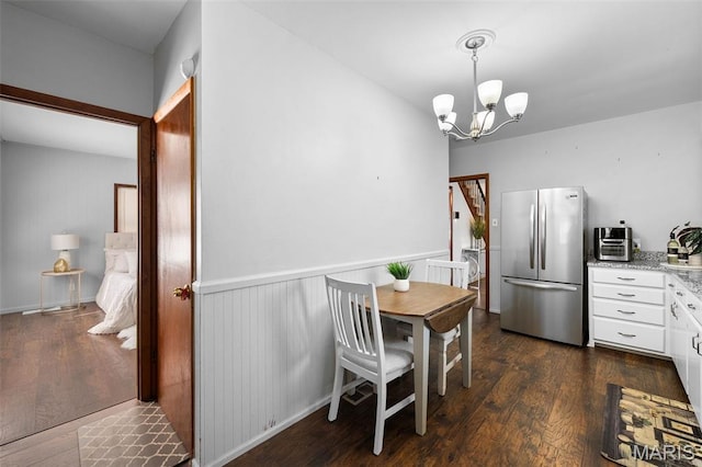 512 N Hills Dr, Saint Louis, MO 63121 - dining area featuring a chandelier and dark wood-style flooring