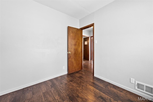 512 N Hills Dr, Saint Louis, MO 63121 - unfurnished room featuring dark wood-style floors and baseboards
