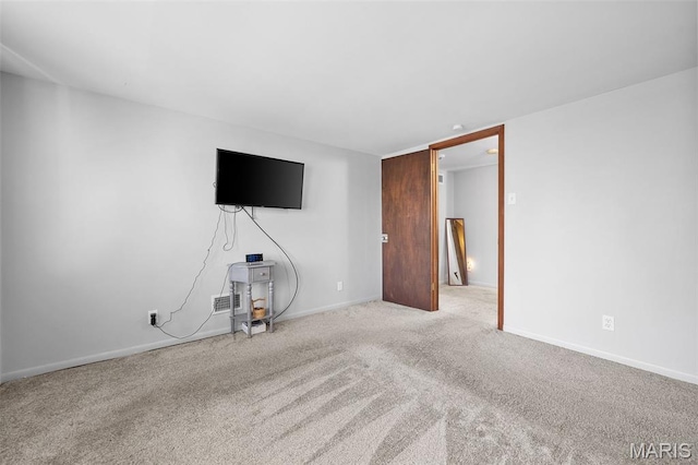 512 N Hills Dr, Saint Louis, MO 63121 - unfurnished living room with carpet floors and baseboards