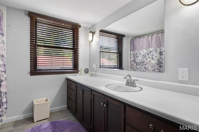 512 N Hills Dr, Saint Louis, MO 63121 - bathroom with vanity and wood finished floors