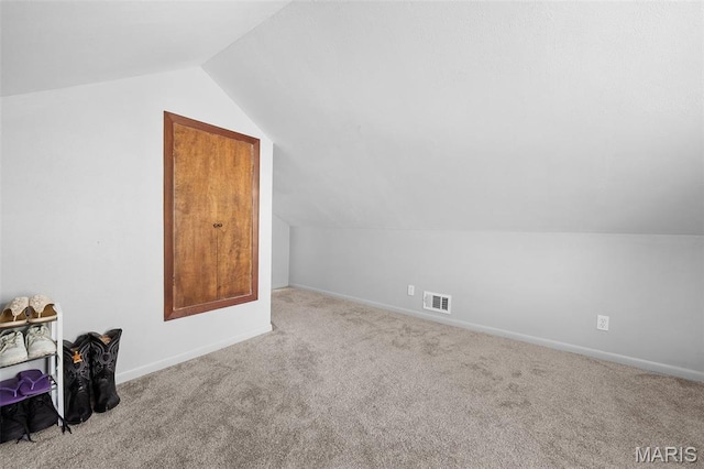 512 N Hills Dr, Saint Louis, MO 63121 - additional living space with lofted ceiling and carpet flooring
