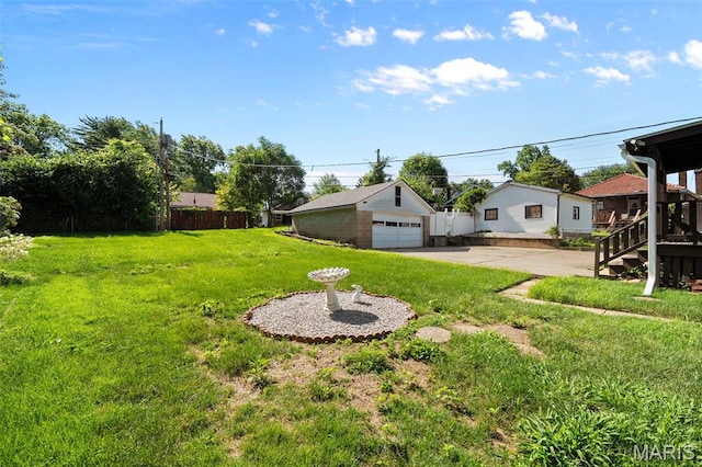 512 N Hills Dr, Saint Louis, MO 63121 - view of yard with a detached garage and an outdoor structure