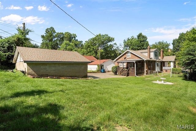 512 N Hills Dr, Saint Louis, MO 63121 - view of green lawn with covered porch