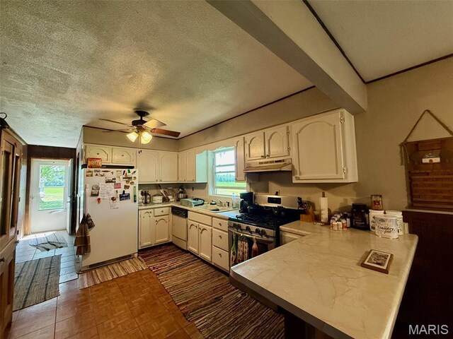 299 E 3050th Ave, Ramsey, IL 62080 - kitchen featuring white appliances, under cabinet range hood, a peninsula, a textured ceiling, and ceiling fan