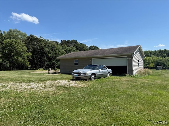 299 E 3050th Ave, Ramsey, IL 62080 - view of side of home featuring a lawn and an attached garage
