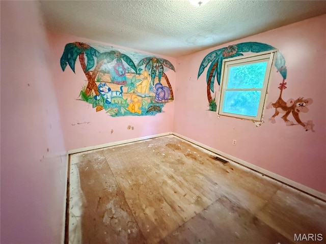335 Sumac St, Payson, IL 62360 - unfurnished room featuring a textured ceiling and baseboards